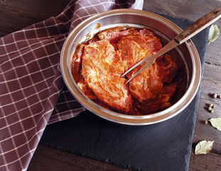 meat marinated in spices on a wooden table
