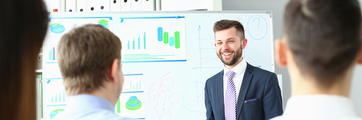 Smiling boss conducts business training for employees. Marketing successful conference concept