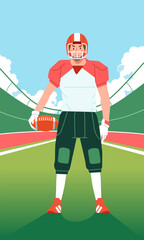 American football player standing in the middle of the field with the ball