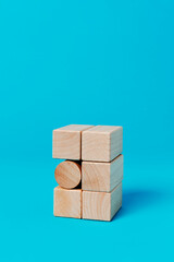 cylindrical toy block among rectangular toy blocks