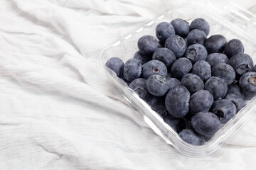Ripe blueberry in a plastic container