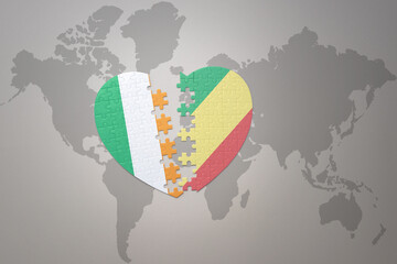 puzzle heart with the national flag of republic of the congo and ireland on a world map background.Concept.