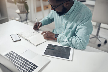 Notebook, planning and business man writing, digital technology and laptop in project budget, finance and goals. Stats, graphs and startup employee or person notes, journal data analysis and computer