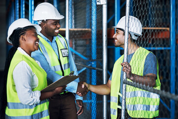 Contractor, team and shake hands at a warehouse for hiring and collaboration at a building company. Builder, together and shaking hand at a construction site for partnership and welcome by leader.