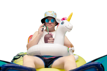 man equipped for the pool with cap, sunglasses, unicorn float, coconut drink, snorkel fins talking on the phone
