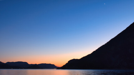 Fototapeta na wymiar Fjord with view of mountains and fjord landscape in Norway. Landscape shot