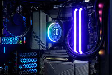 Close-up inside Hi-performance custom computer desktop with liquid pump that installed on socket CPU processor for cooling and LED neon light show status on working