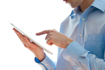A young business man holding a tablet pc