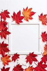Naklejka na ściany i meble A white frame surrounded by red and yellow leaves. Generative AI.