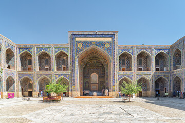 Fototapeta na wymiar Colorful arched niches at courtyard of the Sher-Dor Madrasah