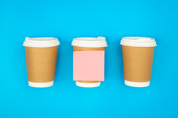 paper disposable cups and paper reminder, top view.