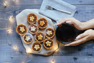 Christmas mince pies with fruit filling on a gray background.