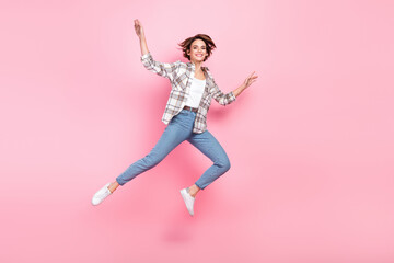 Full body portrait of overjoyed nice lady jumping fly have good mood isolated on pink color background