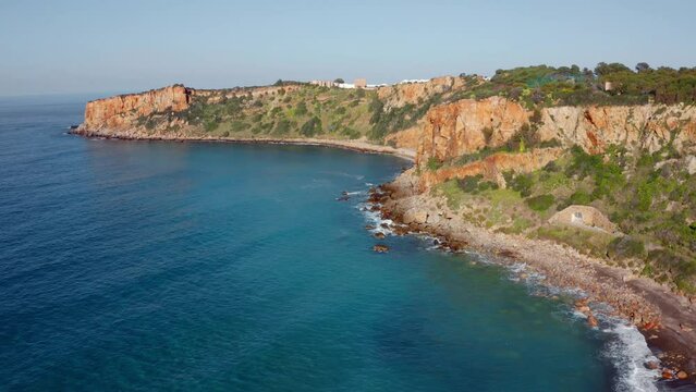 4k drone forward video (Ultra High Definition) of Torre Conca beach. Amazing morning seascape of Mediterranean sea. Attractive outdoor scene of Sicily, Italy, Europe. Vacation concept background..