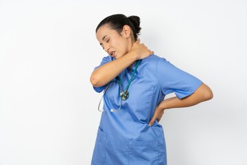Beautiful doctor woman standing over white studio background got back pain