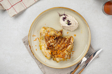 Portion of gourmet cooked chicken with nut cream