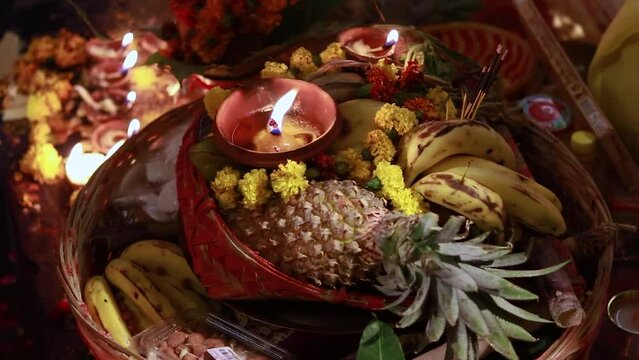 burning oil lamp with offerings during holy rituals at festival from different angle video is taken on the occasions of chhath festival which is used to celebrate in north india on Oct 28 2022.