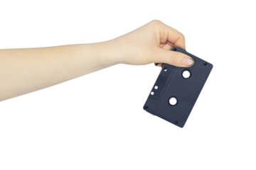 audio cassette in hand, outstretched hand with audio cassette isolated from background