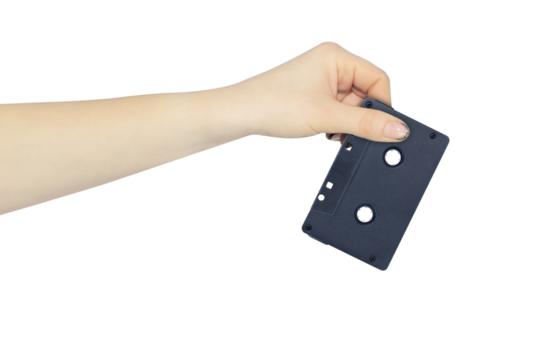audio cassette in hand, outstretched hand with audio cassette isolated from background