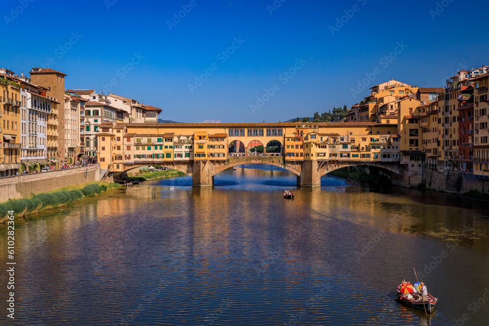 Wall mural cityscape with the famous bridge of ponte vecchio on the river arno river in centro storico, florenc