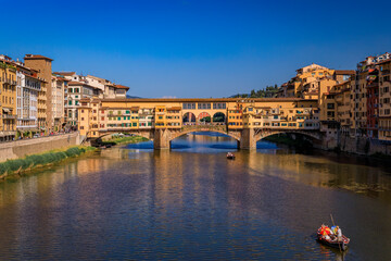 Cityscape with the famous bridge of Ponte Vecchio on the river Arno River in Centro Storico, Florence, Italy - obrazy, fototapety, plakaty