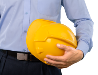 Male foreman holding a hardhat on the construction site