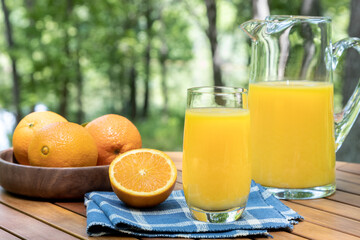 Glass of orange juice outdoors on a table