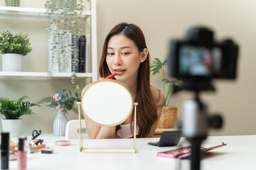 Social media influencer beauty blogger concept, Young beautiful woman recording video review cosmetic and makeup tutorial.