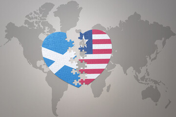 puzzle heart with the national flag of liberia and scotland on a world map background.Concept.