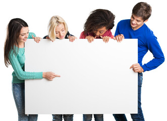 Group of young friends standing looking at a blank sign