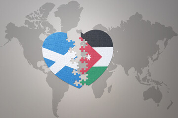 puzzle heart with the national flag of jordan and scotland on a world map background.Concept.