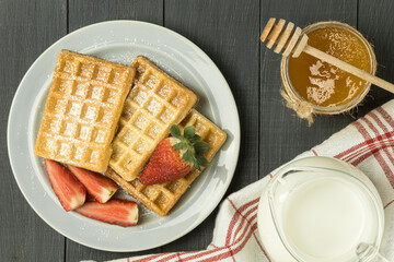 Fresh waffles on the table, freshly baked Belgian waffles