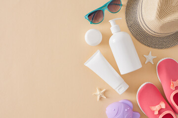 Kids' sunblock cream concept. Top view flat lay of cosmetic bottles without label, pink shoes, beach toy, sun hat, sunglasses, starfish on pastel beige background with empty space for text or branding