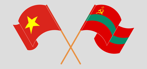 Crossed and waving flags of Vietnam and Transnistria