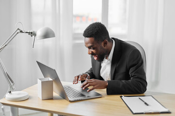 Fototapeta premium man laptop education freelancer job online call student african office computer american