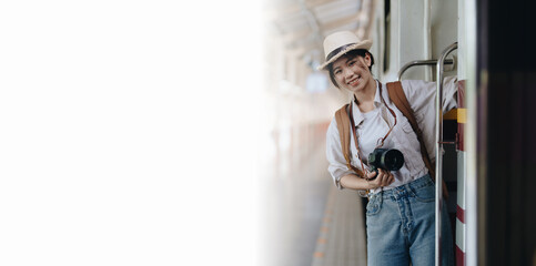 Tourists are showing happy expressions while waiting for their journey in the train station. copy space, copyspace, copy-space white screen concepts.