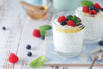Greek yogurt in glasses with berries and quinoa	