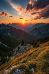 The sun rises from behind the snowy mountains