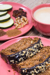 Zucchini dough and cup of white coffee on board. Delicious dessert
