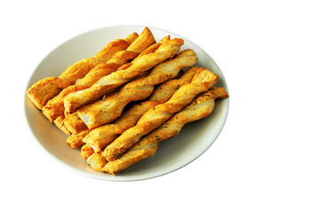 Sticks of buttery yeast dough on a plate on a white background
