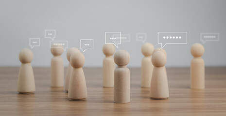 Team discussion concept. Teamwork. Business meeting. Wooden human figure speak for exchange...