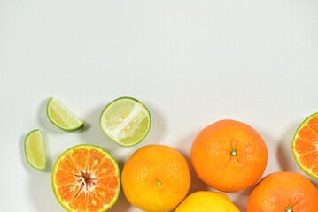 Close up view of juicy organic citrus fruit whole and halved visible core isolated white background copy space Vitamin C packed food concept. flat top view