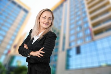 Fototapeta premium Young happy business woman in busy street