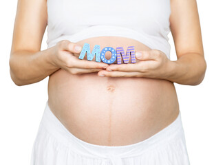 Pregnant woman holding a letter mom in hands