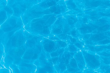 Blue clear pool water with abstract pattern of reflection and wave surface transparent background