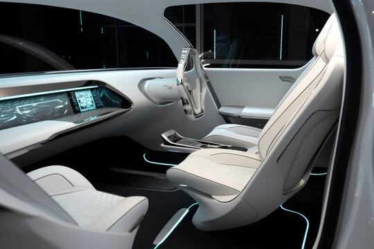 White driverless car interior with futuristic dashboard for autonomous control system . Inside view of cockpit HUD using AI artificial intelligence sensor to drive car without driver. Generative AI