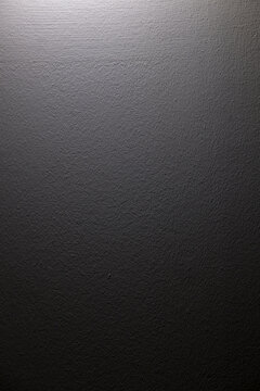 white spotlight effect on the wall, black background