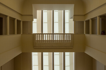 Interior view of art deco 2-storey atrium windows and balustrade