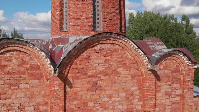 The old Orthodox Church of the Savior on Kovalev on the outskirts of Veliky Novgorod. The view from the drone on a sunny day.