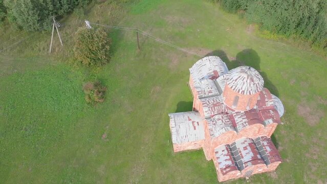 The old Orthodox Church of the Savior on Kovalev on the outskirts of Veliky Novgorod. The view from the drone on a sunny day.